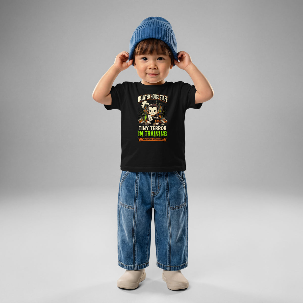 Haunted House Staff Baby “Tiny Terror in Training” Baby Jersey T-Shirt with Tiny Terror in Training front design and matching BABY back graphic for Halloween family outfits