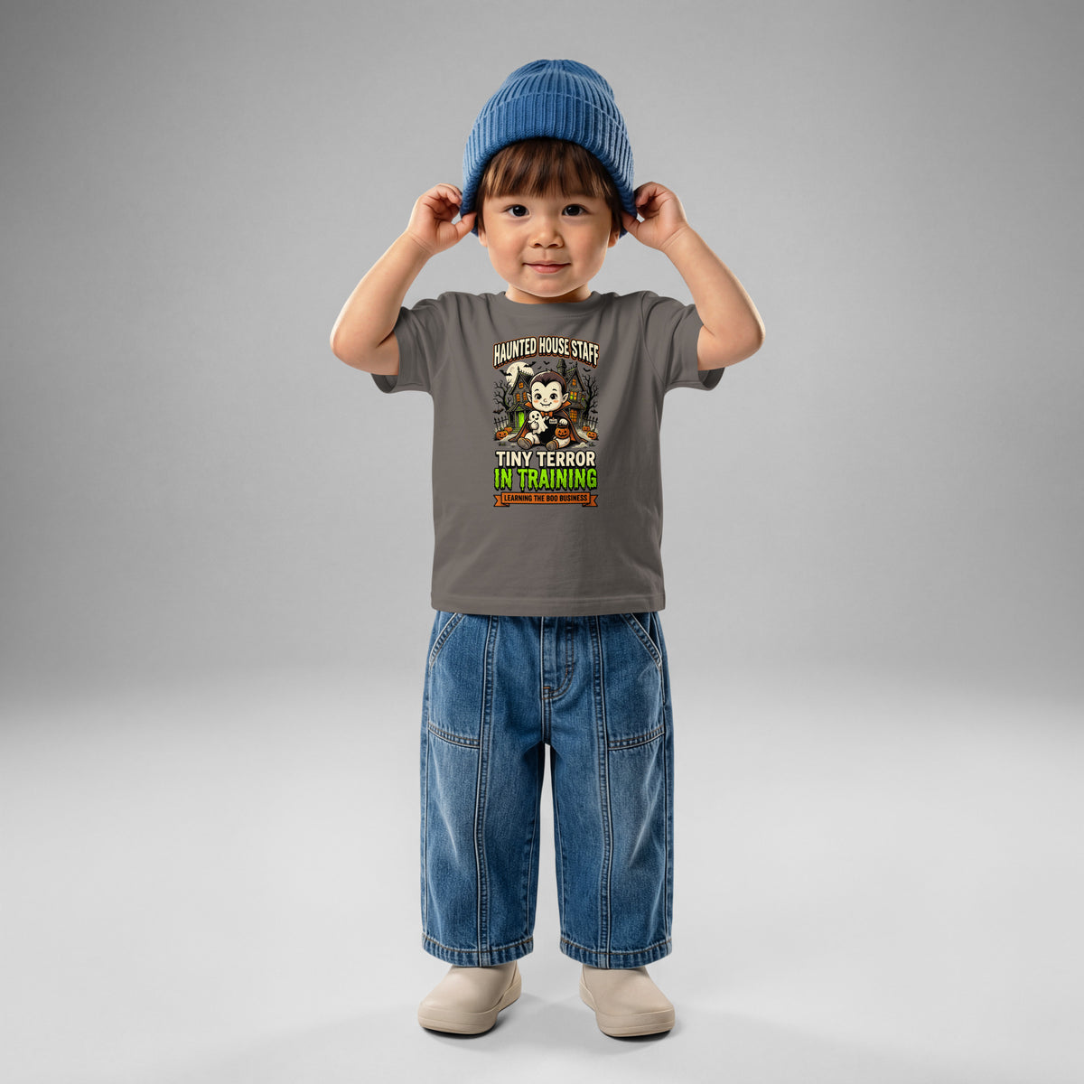 Haunted House Staff Baby “Tiny Terror in Training” Baby Jersey T-Shirt with Tiny Terror in Training front design and matching BABY back graphic for Halloween family outfits