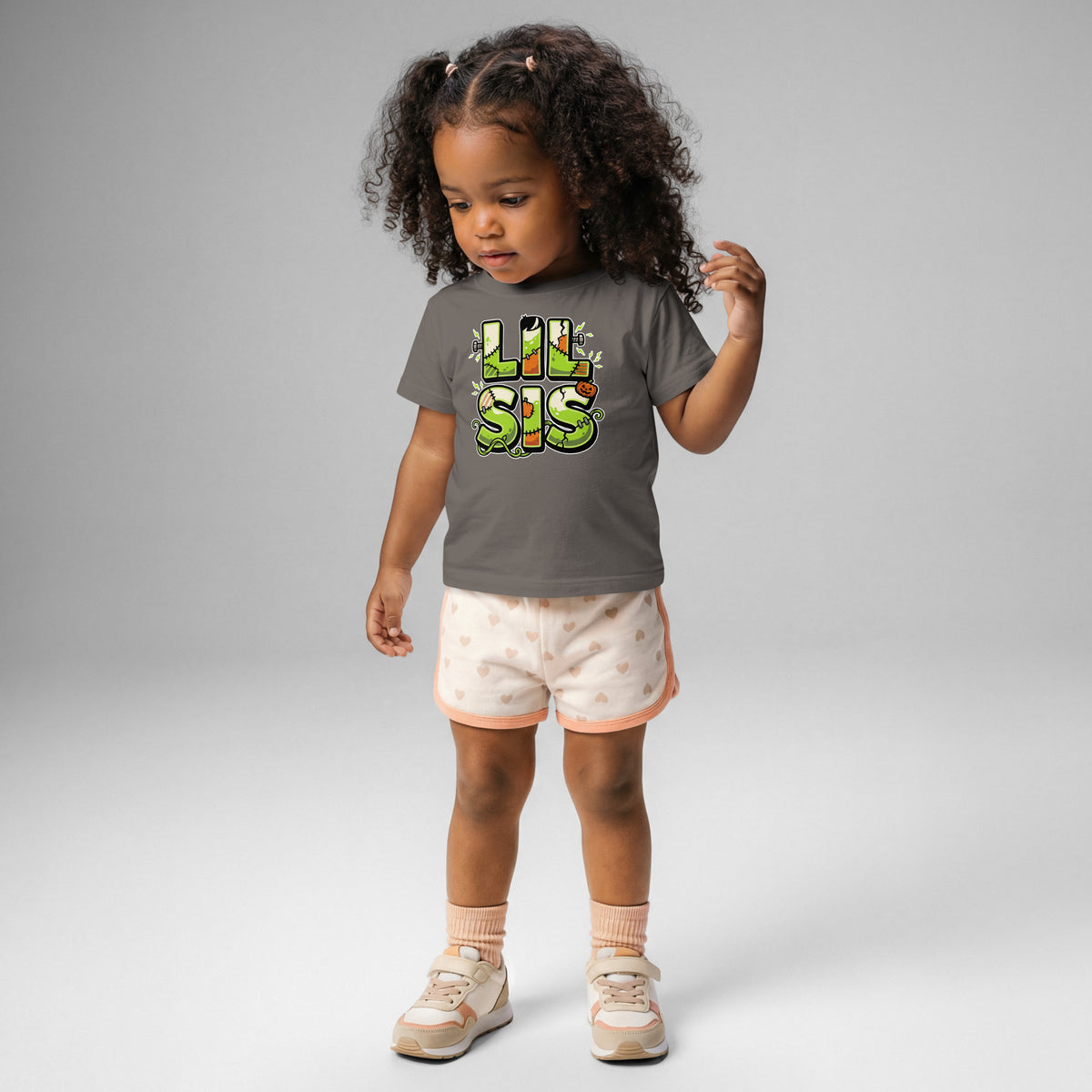 LIL SIS Halloween monster name Baby Jersey T-Shirt in Charcoal with spooky front lettering and blank back
