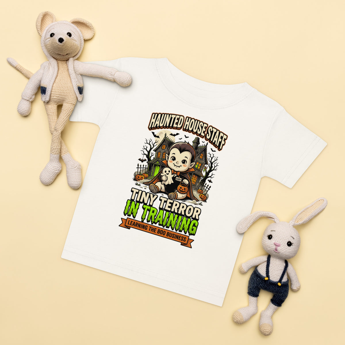 Haunted House Staff Baby “Tiny Terror in Training” Baby Jersey T-Shirt with Tiny Terror in Training front design and matching BABY back graphic for Halloween family outfits