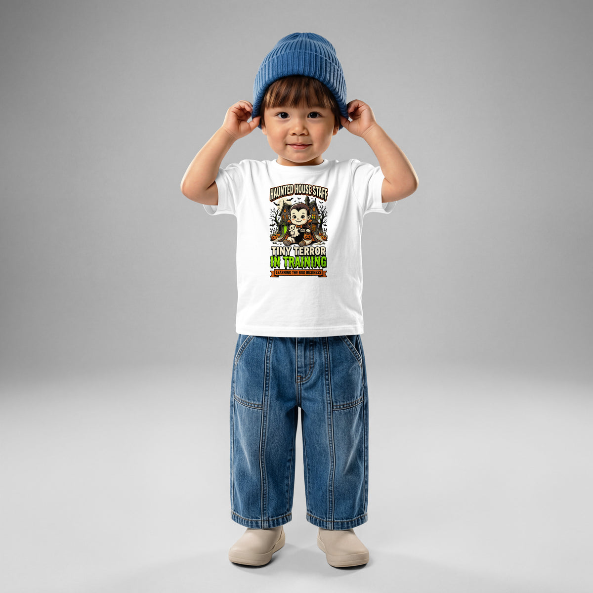 Haunted House Staff Baby “Tiny Terror in Training” Baby Jersey T-Shirt with Tiny Terror in Training front design and matching BABY back graphic for Halloween family outfits