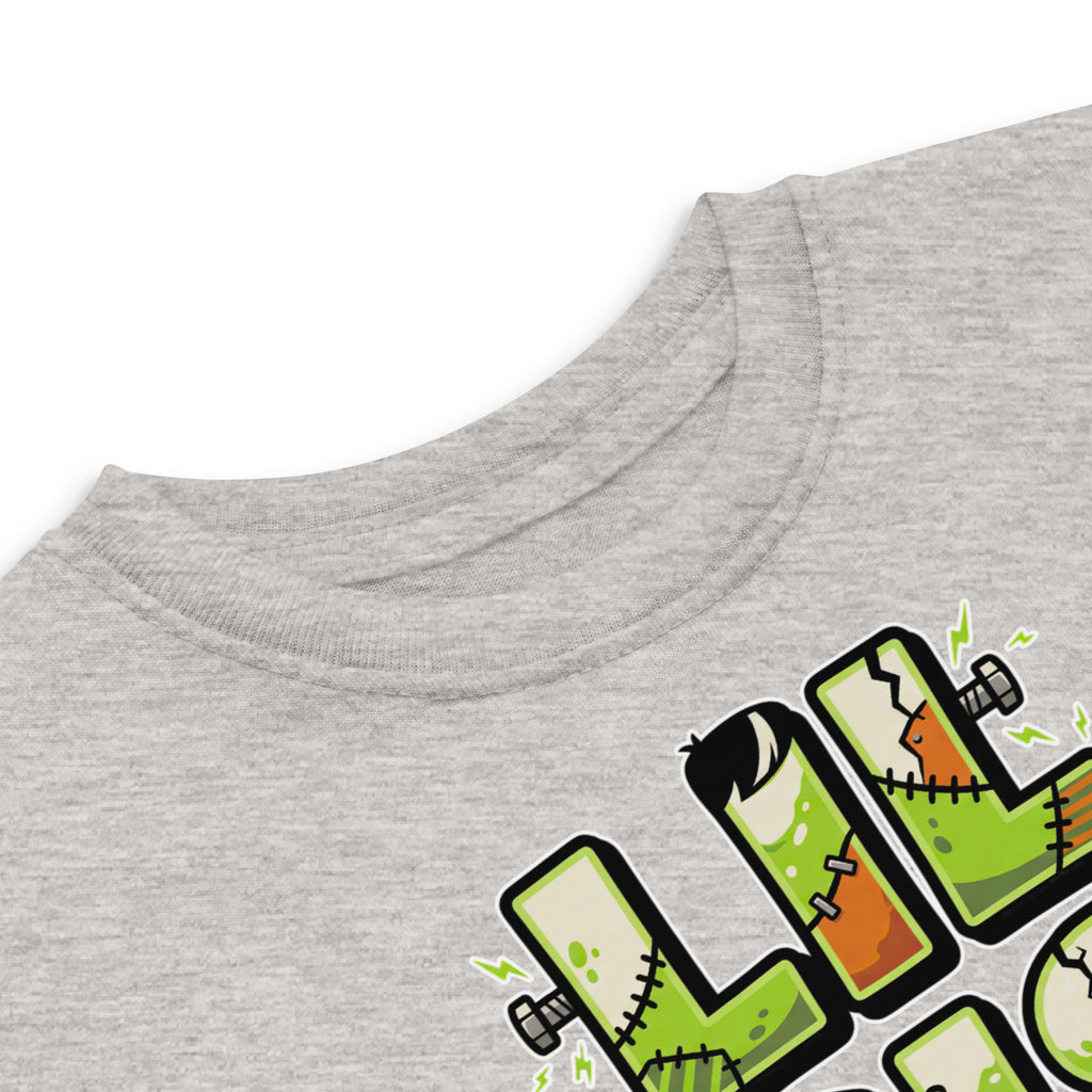 LIL SIS Halloween monster name Toddler Jersey T-Shirt in White with spooky front lettering and blank back