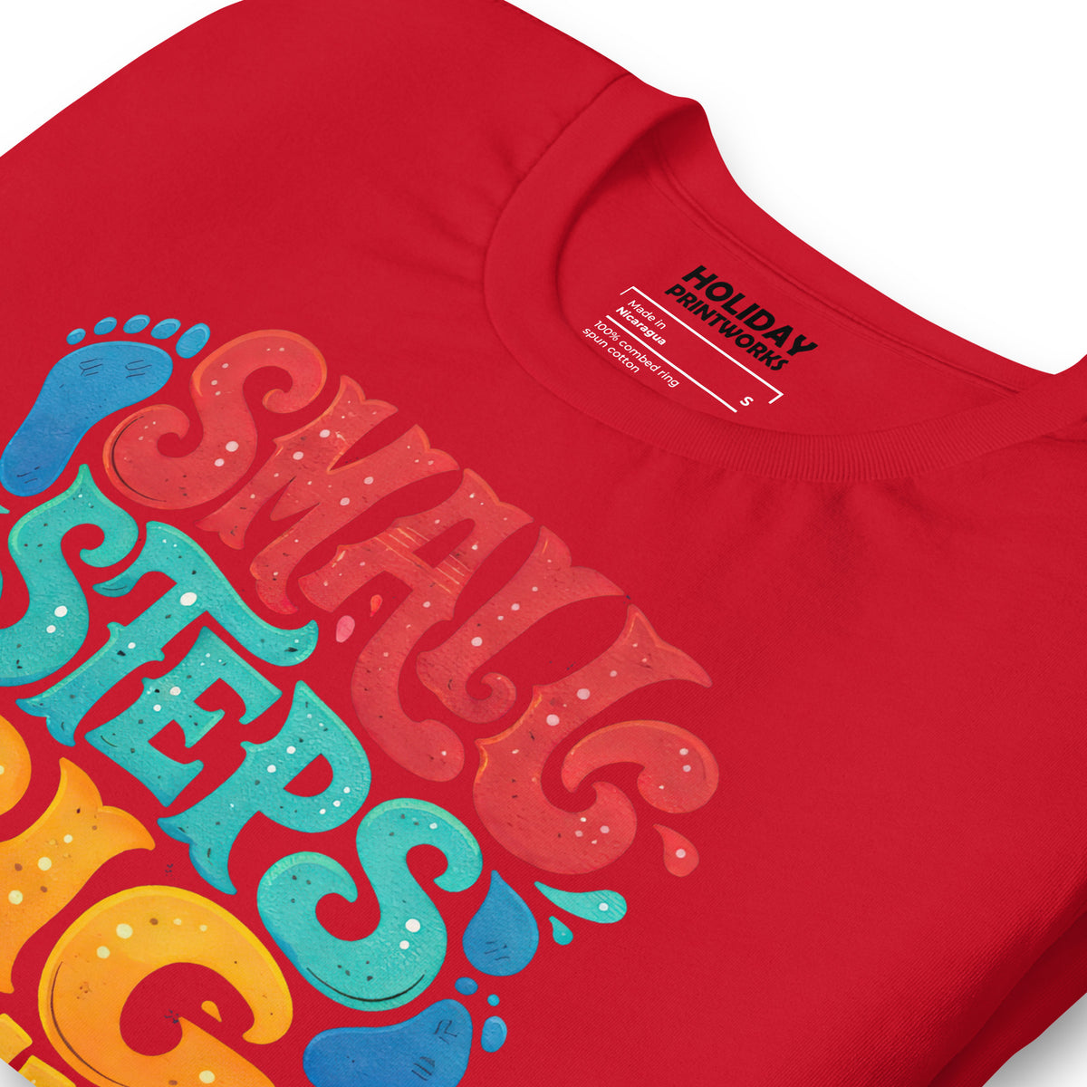 Back/detail view of Small Steps Big Results – Unisex Staple T-Shirt (Motivation Quote) graphic T-shirt