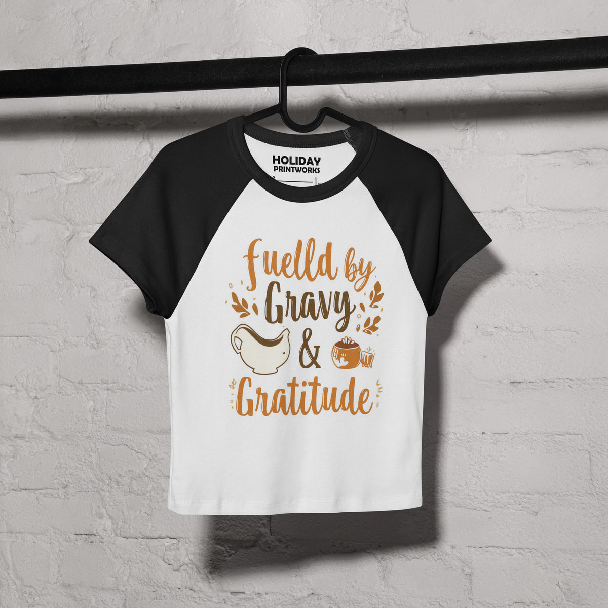 Back/detail view of Fueled by Gravy & Gratitude – Women’s Micro Rib Raglan Baby Tee graphic T-shirt