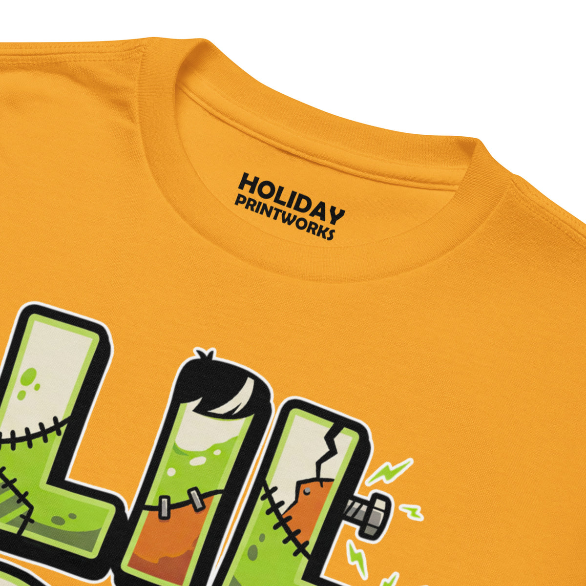 LIL SIS Halloween monster name Youth T-Shirt in Gold with spooky front lettering and blank back